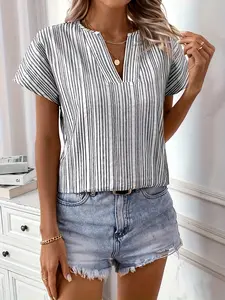A black and white vertical striped V-neck short-sleeve loose blouse top with a small V-neckline and a center slit design. The style is simple and casual, suitable for leisure or office wear. Shirts Womenswear
