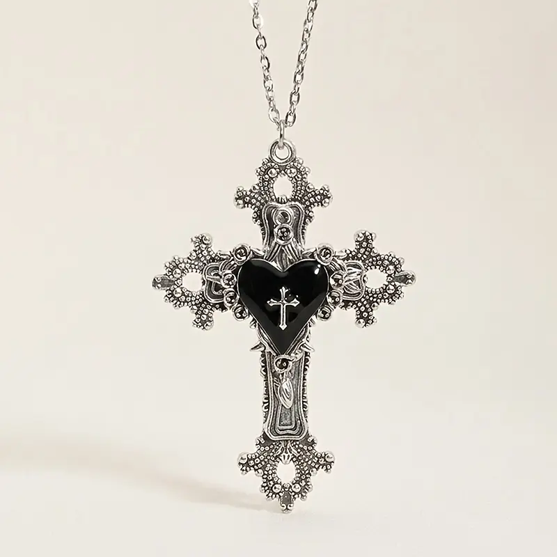 A Y2K Aesthetic Gothic Heart-Shaped Cross Pendant, Featuring a Vintage Hollow Baroque Style Cross Necklace Suitable for All Genders, in an Antique Silvery Color with Dark Romantic Jewelry, Punk Alternative Fashion, Perfect for Parties, Birthdays