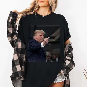 New T-shirt capturing a moment Trump reacting to a heckler at the Ford plant. Designed for both men and women.