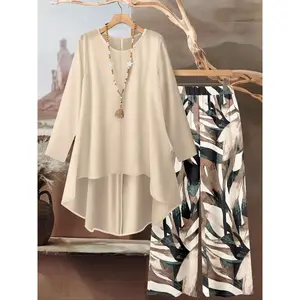 Women’s round-neck irregular-print long-sleeve top paired with a solid-color wide-leg pant featuring an elastic waistband—two-piece set suitable for beach vacations, lounging, everyday outings, holidays, home décor, and casual wear. GARMENTARY