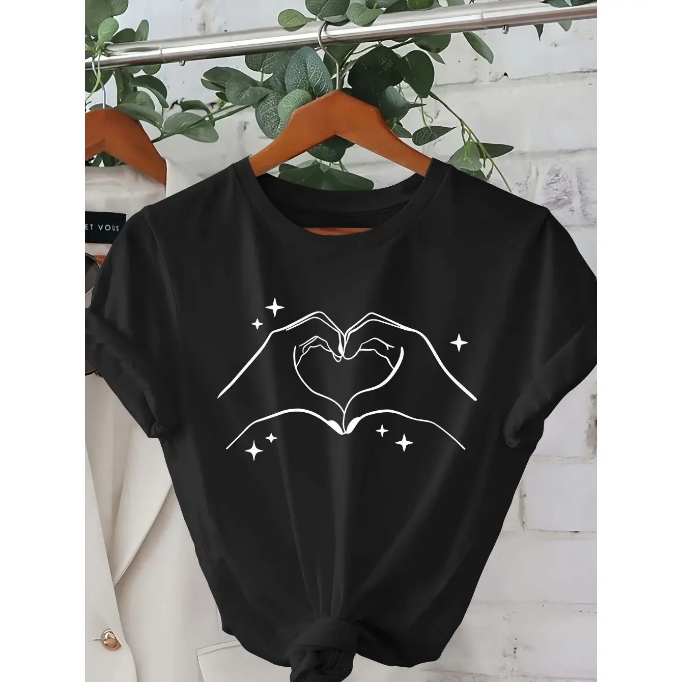 Men's heart and hand gesture print Graphic T-Shirt - Short Sleeve Crew Neck Regular Fit Casual Wear |   Soft & Breathable Fabric, Durable Print, Everyday Comfort, Machine Washable, casual and minimalist line art style clothing displayed on a hanger with