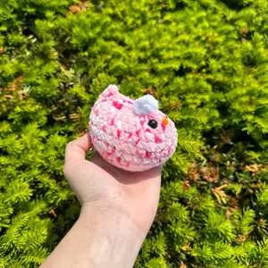 Hand-crocheted pink drink chicken
