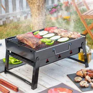 InnovaGoods Portable Charcoal Grill - Foldable & Compact BBQ for Outdoor Cooking - Black Iron Tabletop Grilling Station with Ventilation Holes & Carry Handle - Ideal for 2 Diners - Easy to Store & Transport
