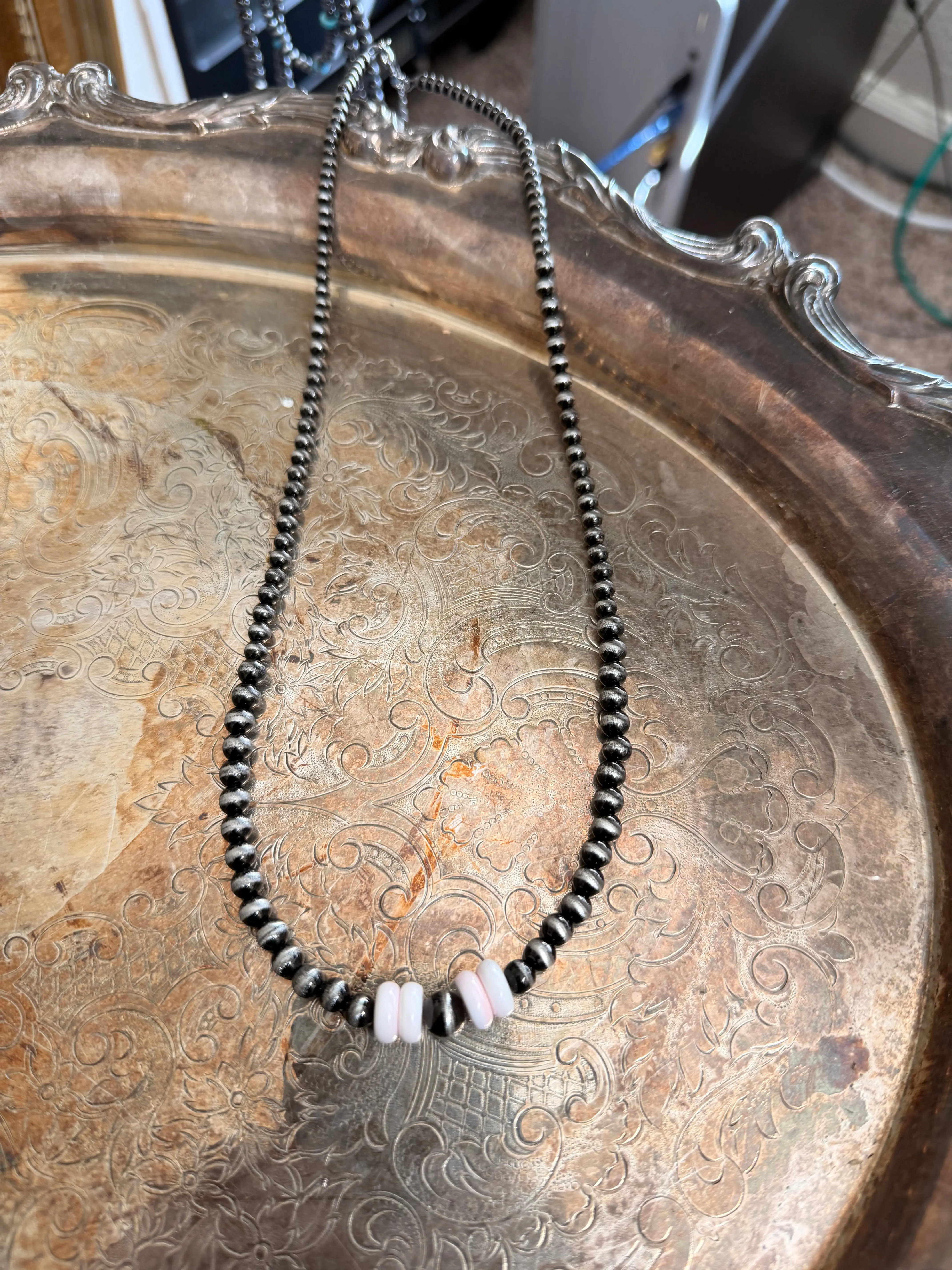 pink conch and stainless steel graduated beaded necklace