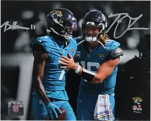 Trevor Lawrence and Brian Thomas Jr. Jacksonville Jaguars Autographed 8" x 10" Teal Spotlight Photograph - Fanatics Authentic Certified