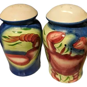 New Matching Pair Of Chesapeake Bay Ceramic Salt, Pepper, Seasonings or Cheese Shakers. Stopper on the bottom so that you can refill them. Approximately 6" tall and 3 1/2" wide. Canister Spice