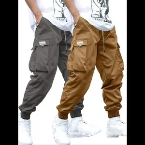 Men's plus size solid color spliced drawstring waist work pants, casual elastic waist flap pocket pants, suitable for daily wear, street wear men's plus size pants suitable for all seasons