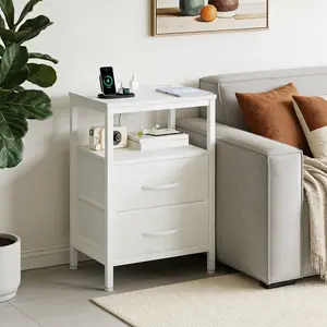 A small bedside table with a charging station and two fabric drawers, and a side bedside table