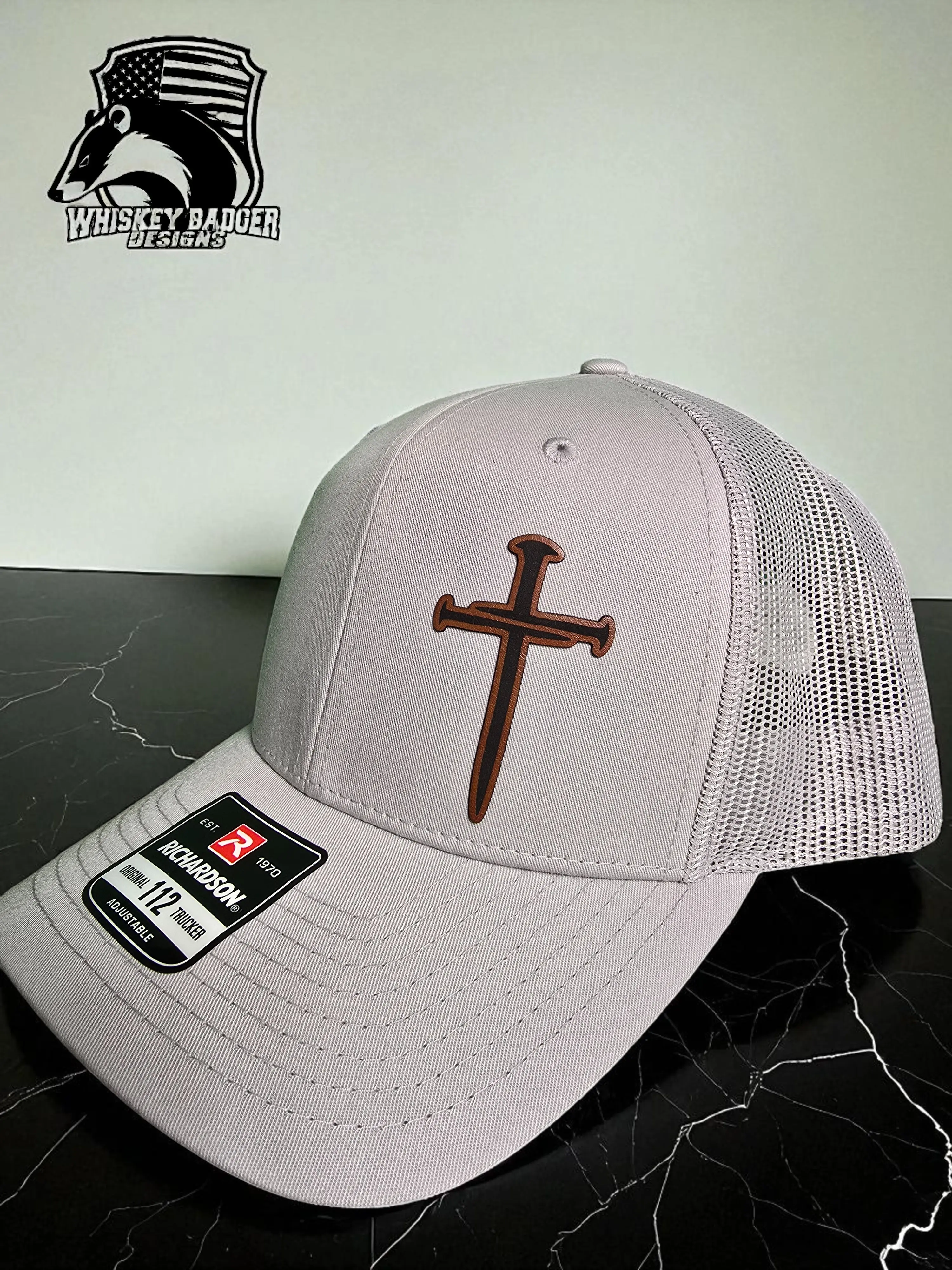 Whiskey Badger Designs Nail Cross Richardson 112 Unisex Trucker Hat with Unique Brown Cross Design