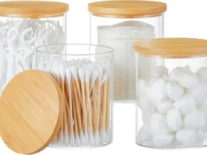 4-Piece Glass Q-tip Holder Dispenser: This set includes glass apothecary jars with lids, perfect for holding cotton balls, swabs, and pads. These essential canisters are ideal for bathroom organization and vanity storage.