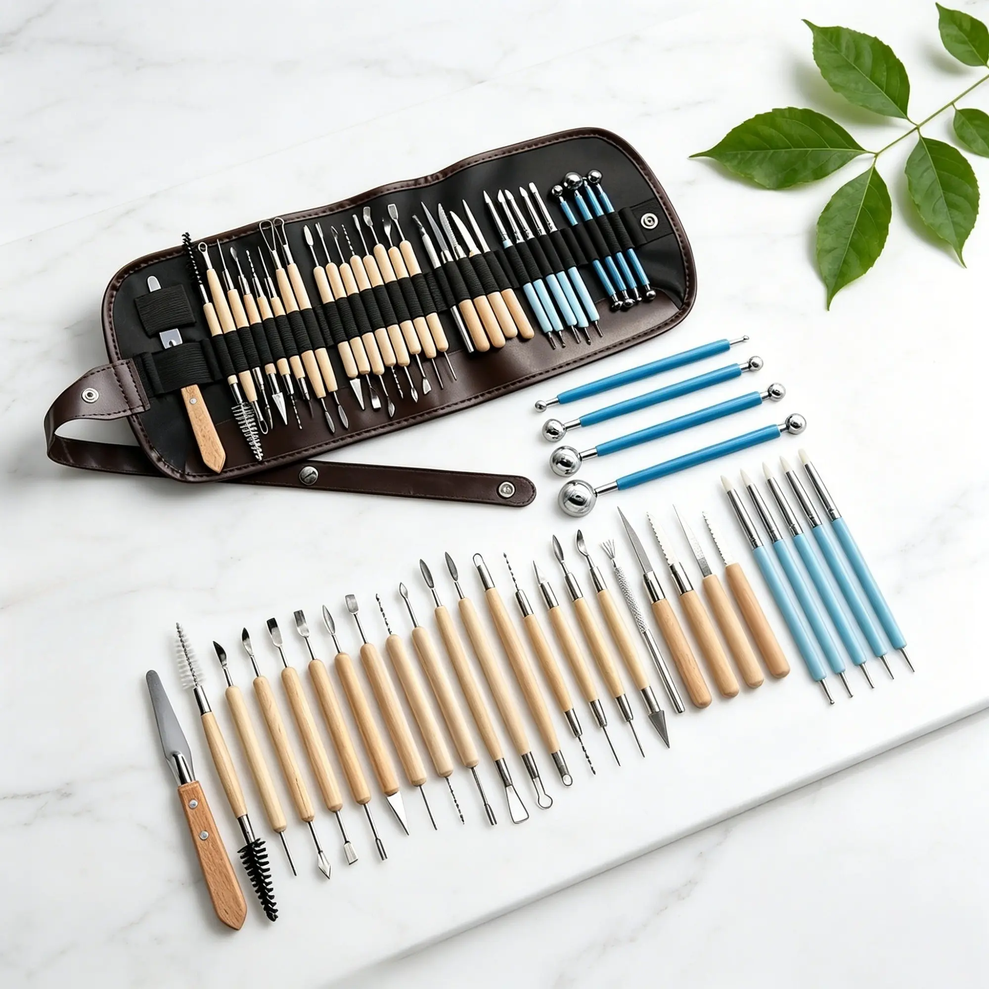 32 piece set of ceramic and clay sculpture tools, including double headed modeling pens, steel ball rods, clay carving tools, and double headed precision tools. This set of ceramic carving tools is perfect for beginners in shaping