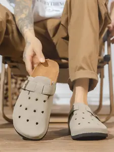 Khaki-toned cork cushioned flat sole fashion slippers, Japanese-style lazy metal buckle, hollowed-out breathable holes, spring and summer suede upper, daily commute mule slippers