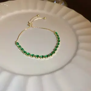 Women's Emerald Green Crystal Tennis Bracelet, Gold-Tone Adjustable Slider-Pull Chain, Elegant Costume Fashion Jewelry Accessory