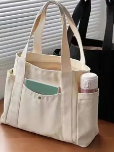 Minimalist, stylish, casual and versatile storage tote bag with multiple compartments for reasonable separation. Large capacity design that can accommodate tablets and files, suitable for commuting, shopping, and school, Casual Commuter Bag