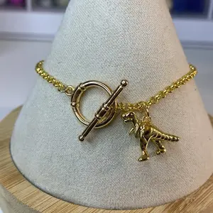 Dinosaur Charm Bracelet 18 Carat Gold Plated Toggle Clasp Unique Jewelry Accessory for Dinosaur Lovers