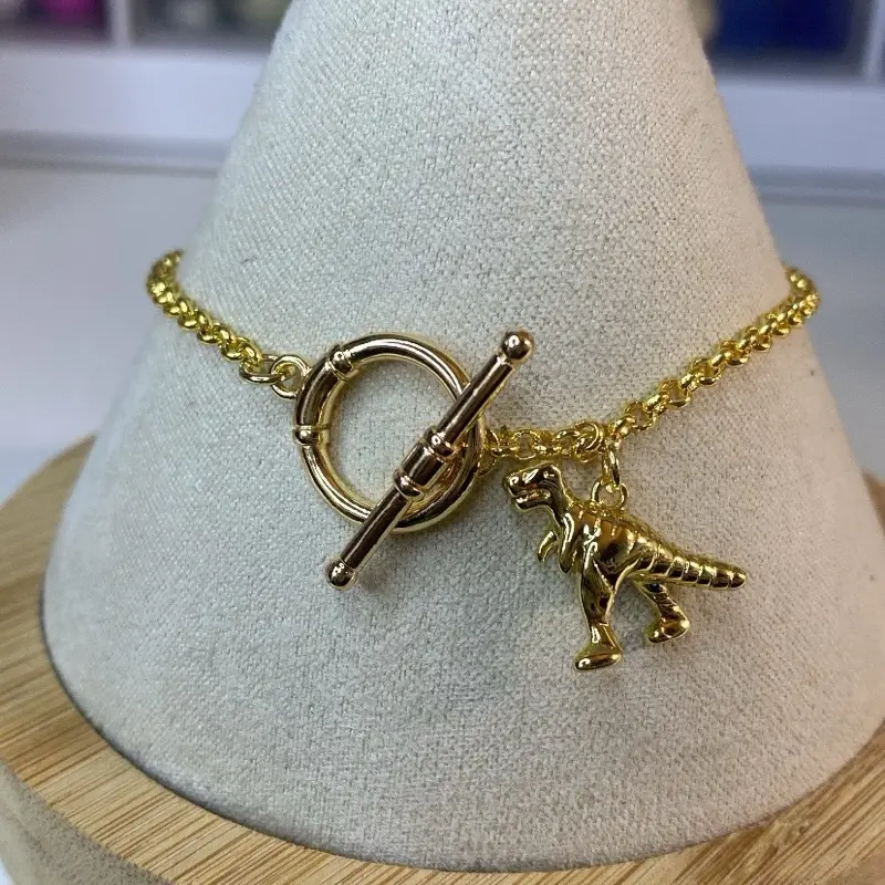 Dinosaur Charm Bracelet 18 Carat Gold Plated Toggle Clasp Unique Jewelry Accessory for Dinosaur Lovers