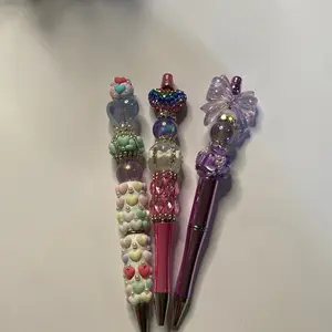 Beaded pen with fancy topper or pen