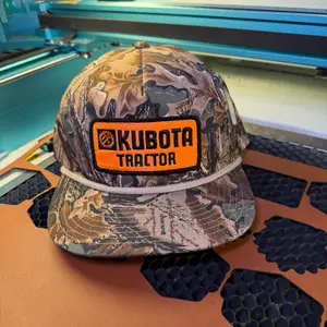 Kabota Tractor Camouflage Hat with Orange Logo and Camo Design