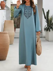 A women's solid color long dress with black ethnic-style embroidery and loose lantern sleeves, Boho casual fashion, featuring a casual retro style, suitable for relaxed stylish occasions such as daily shopping, vacation strolling, Boho Chic Dress