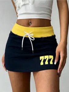 Pack of 2 American hot‑girl mid‑rise athletic mini skirts featuring contrast ribbed waist and drawstring design, “777” numeric print, anti‑exposure hip‑hugging fit; versatile for spring/summer campus casual wear; Y2K tennis mini skirt.