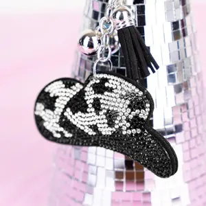 Cow print cowboy hat keychain