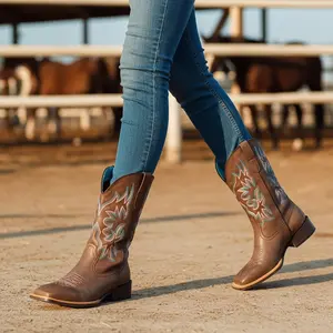 J's.o.l.e's embroidered western cowboy boots feature a fashionable square toe design, a thick heel, and a medium-length ankle strap. These are ideal for everyday walks, music festivals, and weddings.