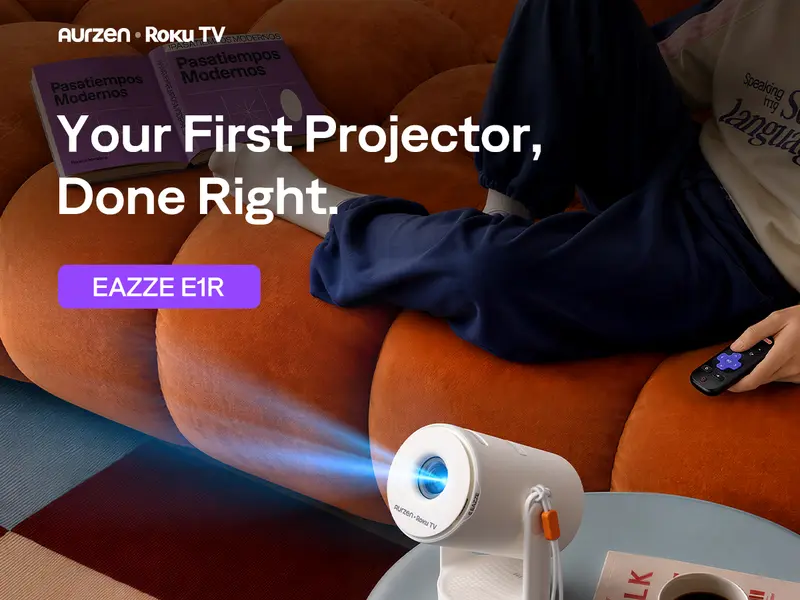 Aurzen EAZZE E1R compact projector on a coffee table