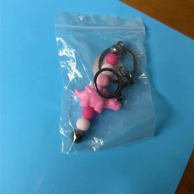 Pink Dino Keychain in Clear Plastic Bag - Simple Product Description Provided