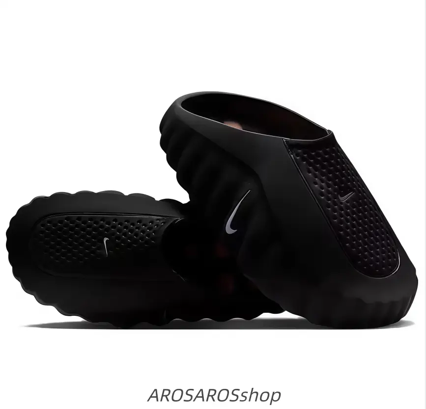 All-black slip-on athletic shoes with hollow drainage holes, non-slip grip sole, ideal for summer water activities.
