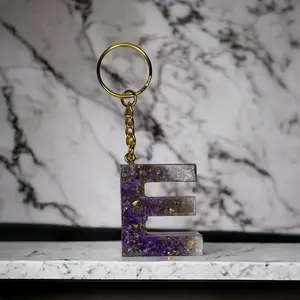 E Resin alphabet keychain purple with silver and gold flakes. Engagement