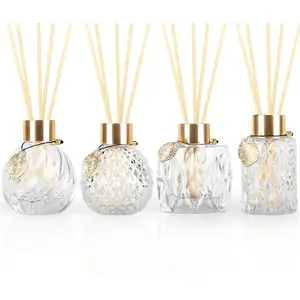 4-Piece Reed Diffuser Set with Metal Golden Decoration, 3.5-4.2oz Empty Bottles and 20 Reed Sticks, Unique Design for Home and Office (4 Different Bottles)