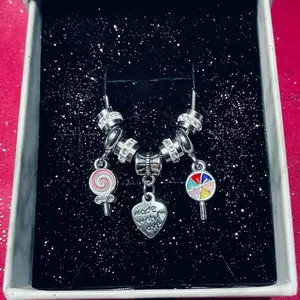 Darah. Charm necklace meaning compassion.