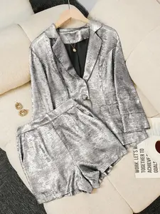 A two-piece women's Loose Casual blazer suit, consisting of a blazer and shorts, suitable for home wear, indoor activities, and outdoor outfits.