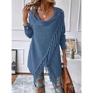 Shawl with fringes and decorative tassels on the front