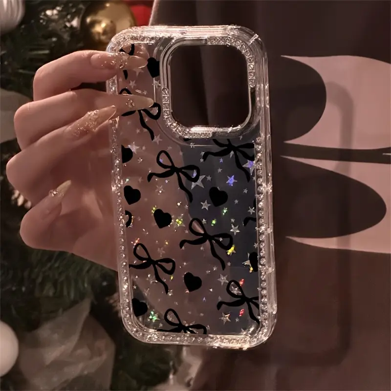 Black heart and bowknot pattern, transparent glitter diamond frame star case, shockproof, sparkling protective case, suitable for iPhone 17, 16, 15, 14, 13, 12 and other series models, can be given as a gift to friends or family.