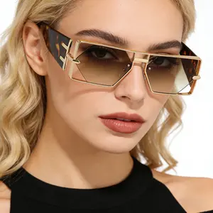 A pair of retro luxury hollow sunglasses with golden geometric frame, fashionable and trendy large frame sunglasses, unisex glasses