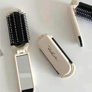 1pc Foldable Hair Brush with Built-In Mirror – Compact Travel Tool for Detangling, Office & Commute. Perfect Gift for Travelers, Pros & Beauty Lovers.