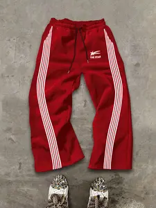 Street - style men's winter straight loose sweatpants, Athleisure pants, Y2K design, red main color, neat white side stripes, "THE STAR" star - shaped text print, fashionable & eye - catching. Shows trendy attitude in winter sports/street outings.