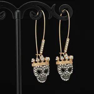Gold Crowned Skull Drop Earrings Rhinestone Punk Rock Statement Jewelry for Women Gold-tone Metal with Glass Crystals Asymmetrical Sun Moon Design