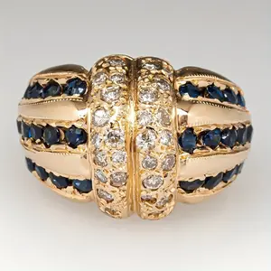 Vintage Two-Tone Statement Ring.Gold Tone Blue & Clear Crystal Jewelry.Bold luxury fashion jewelry.Ornate vintage statement piece.Polished gold tone finish.Wide band heavy design.Bold vintage fashion ring.Evening wear luxury accessory
