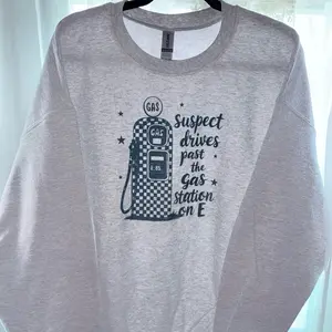 Suspect drives past gas station on E Crewneck sweatshirt