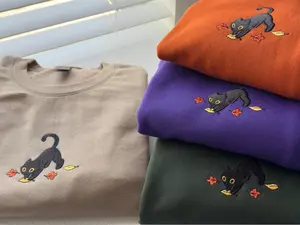 Cute Black Cat Pouncing Autumn Leaves Cozy Embroidered Unisex Sweatshirt