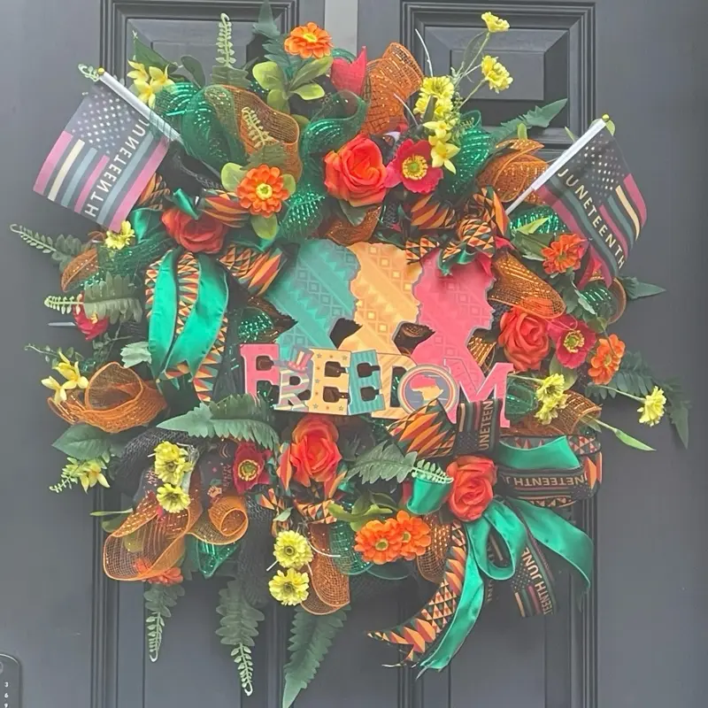Juneteenth Wreath - Colorful Floral Design with "FREEDOM" Text, Featuring Various Colors and Textured Bows.