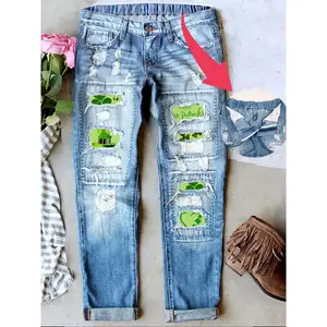 Women's tattered boyfriend jeans, vintage washed St. Patrick's Day patches, clover print denim jeans, casual fit, natural waist buckle, fly casual denim pantsRAIMENTRY