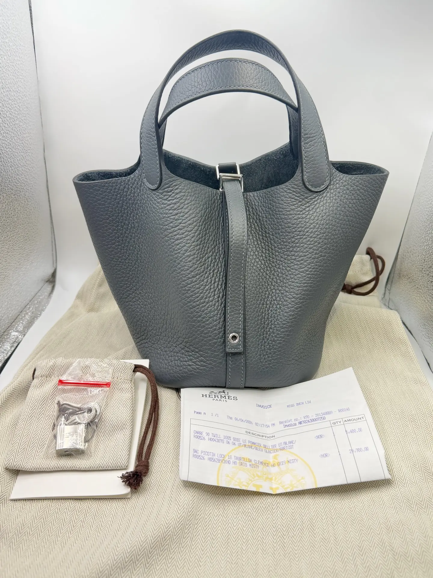 Pre-owned HERMÈS Picotin Lock 18 Bag in M8 Gris Neve (Misty Grey) with Silver Hardware, Tadelakt Leather, G Stamp. Unused Condition. Purchased in Hong Kong with June 2026 Receipt. Comes with Lock, Keys, Receipt, and Dust Bag. Available at a Great Price.