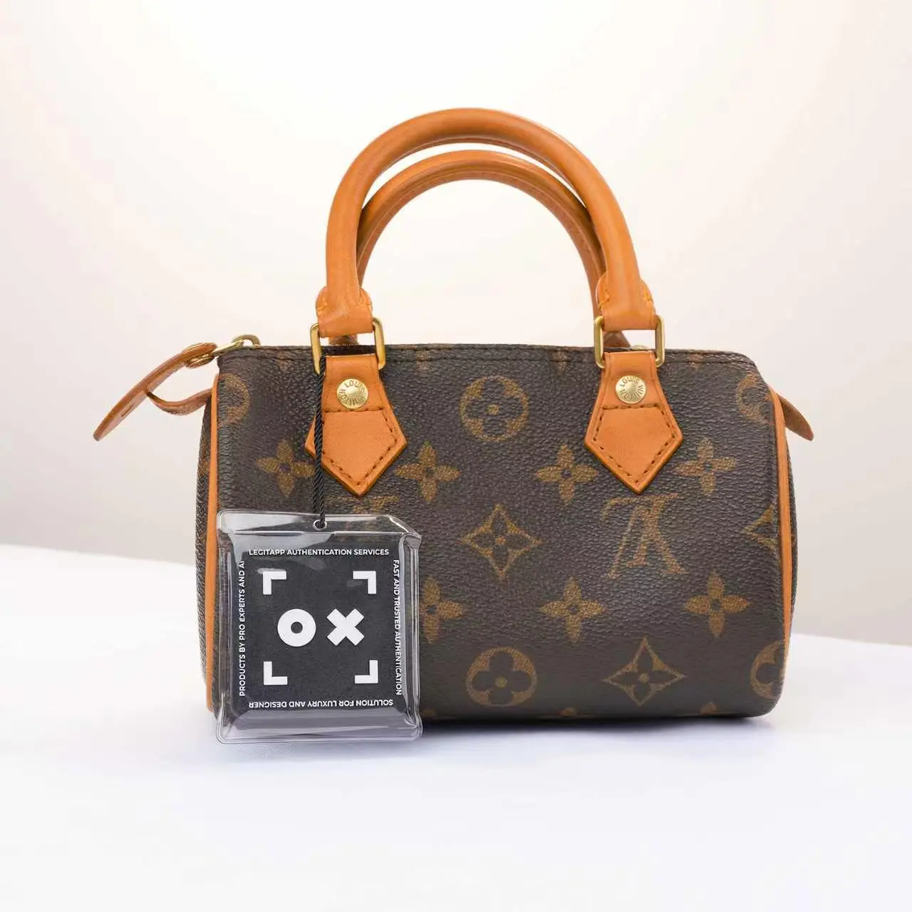 Pre-owned Louis Vuitton vintage LV Mini Speedy pillow bag is crafted from iconic Monogram coated canvas with natural cowhide leather handles.