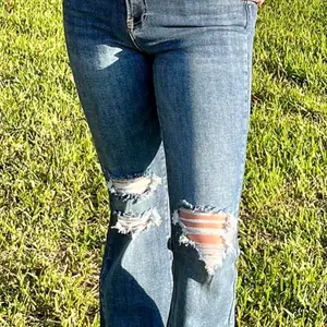 Risen High-Rise Shadow Hem Distressed Flare Jeans