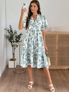 A women's fashionable versatile white base blue hydrangea print V-neck short sleeve layered hem midi dress, suitable for shopping, afternoon tea, or commuting.