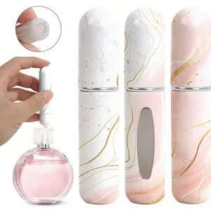 A sample of a mini 5ML spray bottle with high-end marble pattern. It can hold perfume. The portable Lightweight atomizer bottle can be filled with perfume spray directly at the bottom. It is suitable for travel and going out