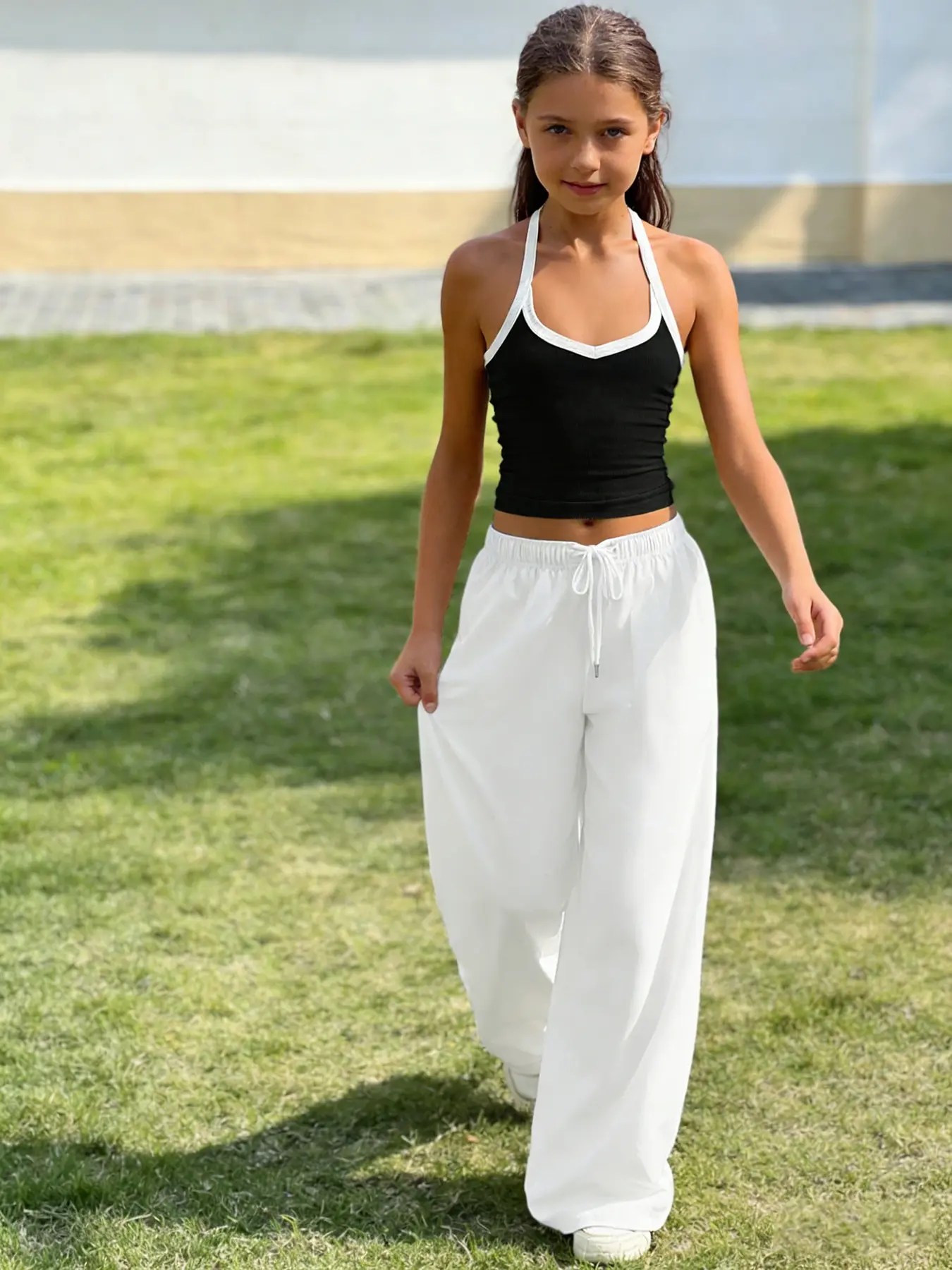 Black and white contrasting halter top for teenage girls, versatile for casual wear, outdoor yoga, beautiful back design, comfortable, breathable and lightweight, machine washable and dry cleaning, essential item for dressing, youth clothing